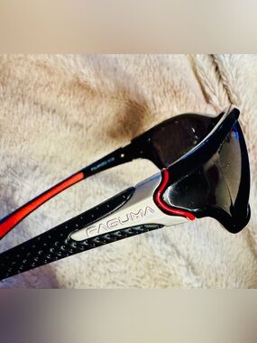 Faguma Italian wrap around, polarized, black sunglasses with red rubber ear grip